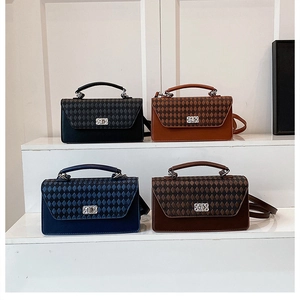 Detail of quilted texture and silver twist lock on stylish crossbody bags in four colors