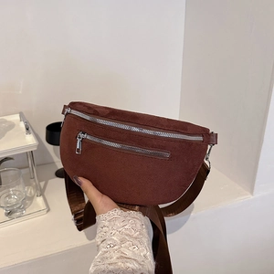 Dark brown corduroy crescent chest bag with adjustable wide strap and silver zippers