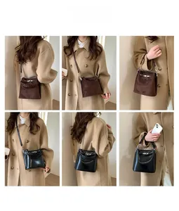 Detailansicht der Vintage-Mini-Eimertasche mit geflochtenem Griff und Metallverschluss