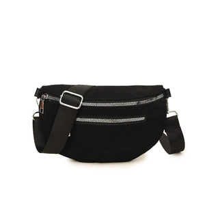 Minimalist black crescent crossbody bag with double silver zippers and wide fabric strap