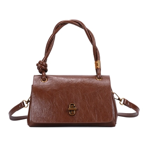 Retro brown crossbody bag with knotted handle and gold twist lock in pleated finish