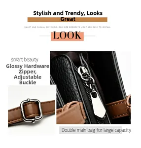 Detail of black lychee grain tote with brown adjustable strap and shiny metal hardware
