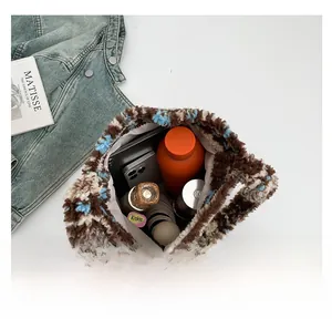 Spacious plush tote bag interior showing capacity for tablet, umbrella and daily essentials