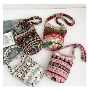 Top view of four patterned plush bucket bags with soft textures for autumn and winter