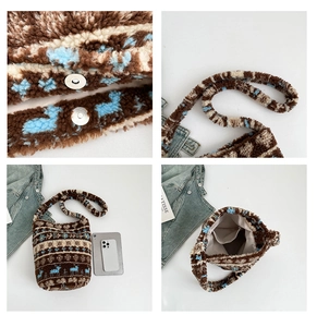 Detail of plush bucket bag with snowflake patterns, magnetic clasp, and interior pocket
