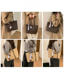 Detail of vintage tote bags in coffee and beige with silk scarf handle decorations