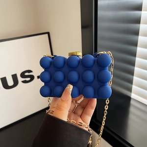 Blue acrylic clutch bag with bubble texture and gold chain for evening party