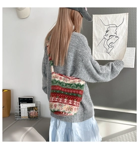 Detailed view of large plush striped tote bag worn on shoulder for winter fashion
