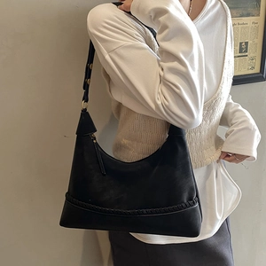 Retro black matte leather hobo bag with woven details and adjustable strap for women