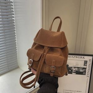Vintage caramel brown suede backpack with double front pockets and adjustable straps