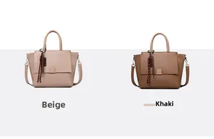 Detail view of beige and khaki minimalist tote bags with striped decorative charms