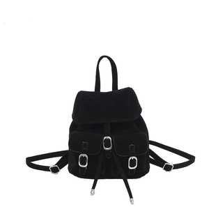 Retro black velvet backpack with drawstring closure and silver buckle pockets on white background
