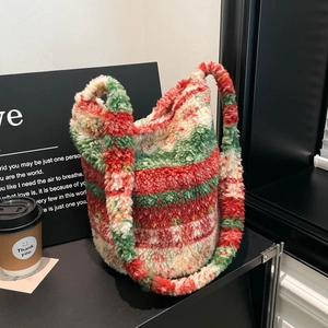 Fuzzy striped lambskin plush bucket bag in red, green and white for festive style