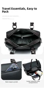 Detail view of multi-compartment interior and back pocket of the black leather pillow bag