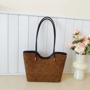 Retro faux suede tote bag with white quilted stitching and elegant leather handles