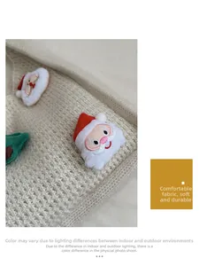 Detailed view of woven tote bag fabric with Christmas embroidery patches