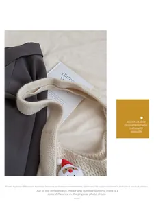 Detail of beige knit tote bag featuring a cute Santa Claus doll and soft wide strap