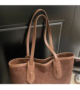 Close-up of comfortable reinforced leather shoulder straps on a leopard tote bag