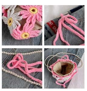 Detail of handmade crochet flower bag featuring pearl strap and natural linen lining