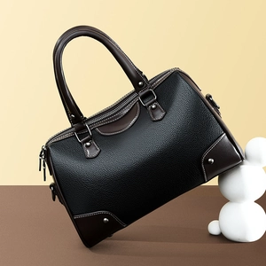 Retro Boston style leather handbag in black and brown contrast with silver studs