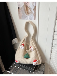 Detail of cream knit tote bag with festive 3D Santa and Christmas tree decorations