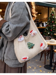Detailed knit of cream tote bag with 3D Santa and Merry Christmas tree motifs
