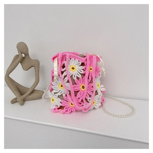 Detail of handmade daisy crochet bucket bag with pearl strap and drawstring lining