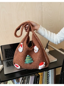 Detail of knit tote bag featuring plush Santa Claus and Christmas tree 3D patches