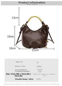 Detail view of brown cloud bag featuring golden arc handle and drawstring design