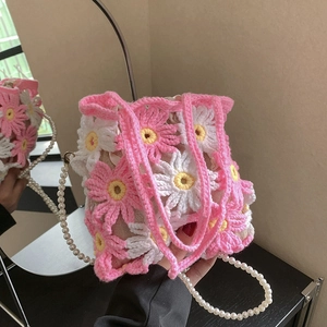 Handmade crochet daisy bucket bag with pink flower patterns and pearl chain strap