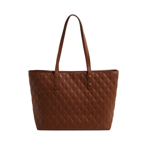 Classic dark brown quilted leather tote bag with long handles and golden metal rivets