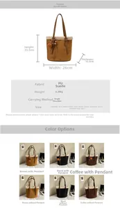 Detail view of suede bucket bag featuring plush trim and heart-shaped pendant accessory