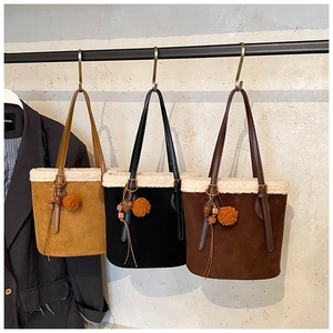 Three suede bucket bags in yellow black and brown with faux fur trim and cute charms