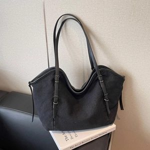 Retro black canvas tote bag with adjustable shoulder strap for casual commuting