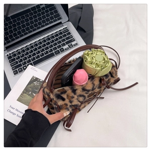 Detailed view of leopard faux fur handbag showing inner capacity for daily essentials