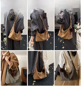 Model display of large faux suede shoulder bags in vintage brown and olive green colors