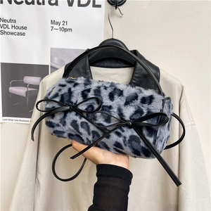 Faux fur leopard print cylinder handbag with chic black leather double bows and round handle