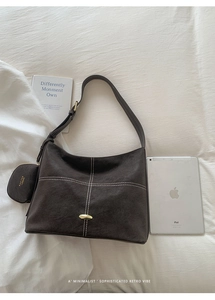 Detail view of coffee brown tote with contrast stitching and attached coin purse