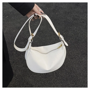 White crescent crossbody bag with lychee texture leather and gold hardware detail