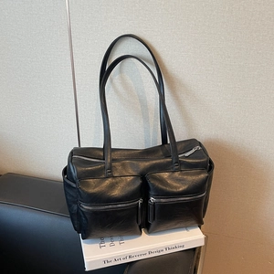 Minimalist black faux leather underarm shoulder bag with double zipper pockets and strap