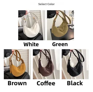 Detail view of crescent crossbody bags in five colors with textured leather and gold hardware