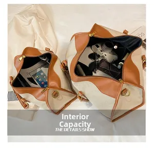 Detail showing high-capacity canvas travel bag with leather trim and interior storage