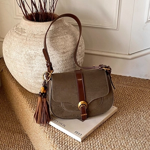 Retro saddle shoulder bag in dark green suede and brown leather with gold buckle