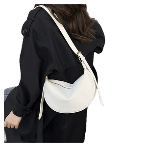 Minimalist white crescent leather crossbody bag for women with adjustable strap and gold buckle