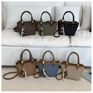Group display of chic crossbody bags in six colors with decorative woven straps