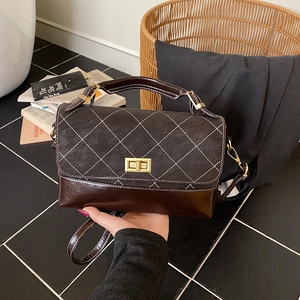 Retro chocolate brown quilted crossbody bag with contrast stitching and gold clasp