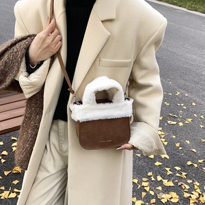 Winter plush suede bucket bag in brown with white faux fur trim and shoulder strap