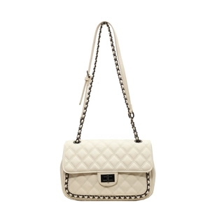 Chic cream quilted shoulder bag with chain strap and metallic twist-lock closure