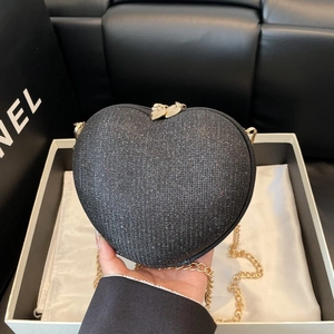Elegant heart-shaped evening bag in black glitter finish with gold chain strap