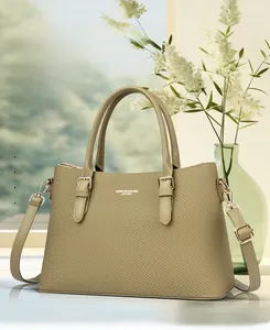 Close-up of olive green tote bag featuring twill texture and detachable shoulder strap